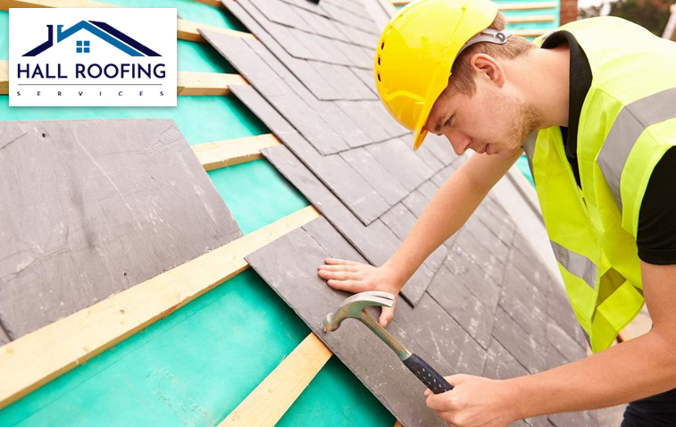 Roofer installing slate roof, ensuring proper installation for longevity